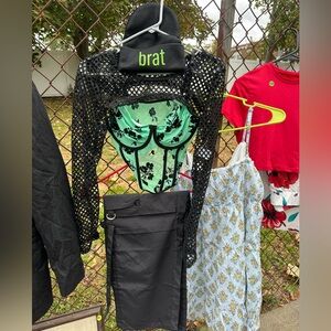 Black Mesh Top with Green Floral corset top and black cargo pants with hat